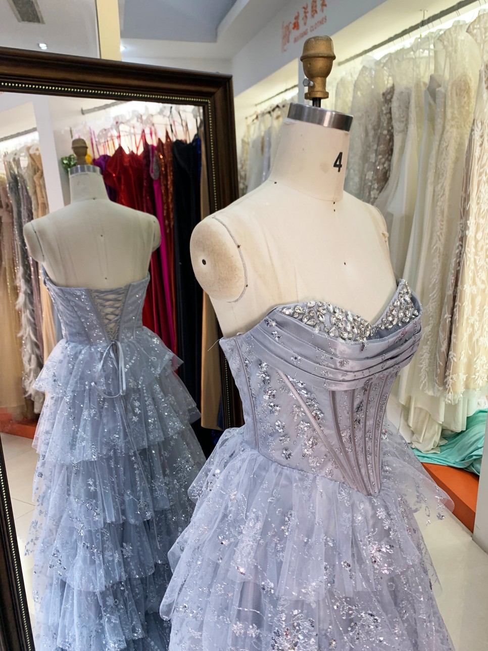 Dusty Blue Wholesale Prom Dresses 2026 2027 Evening Dress Factory Strapless Rhinestone Corset Tiered Ruffle Ball Gown Supplier