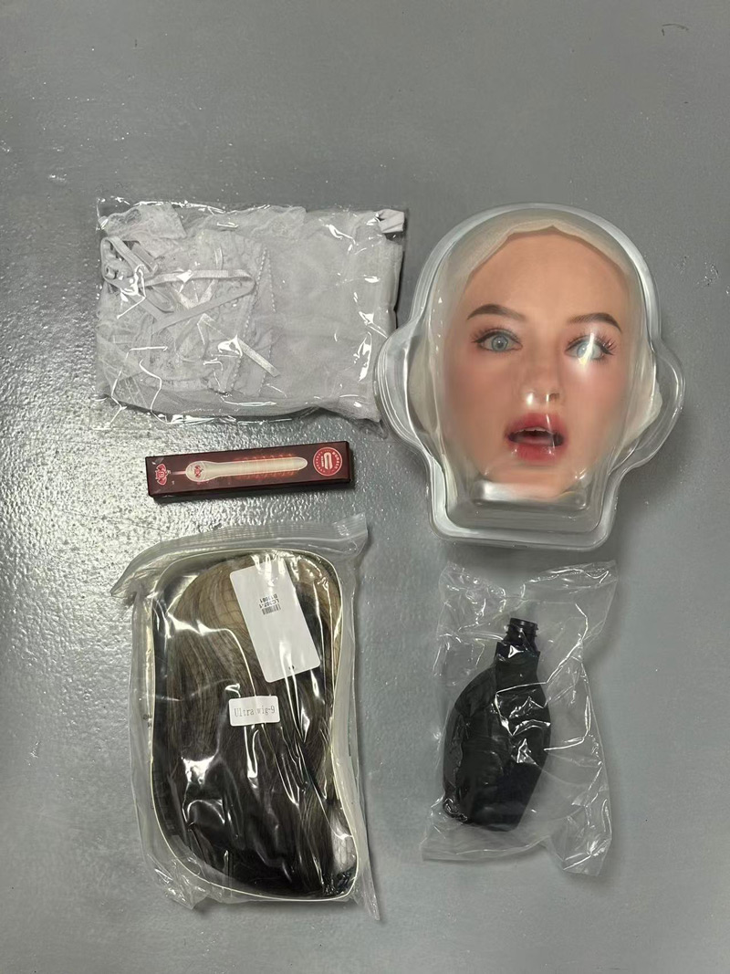 Close-up of doll wig and lubricant