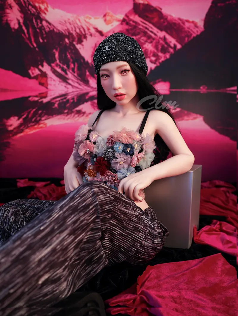 Full-size-sex-doll-Janice-sitting-on-floor-hands-on-stool