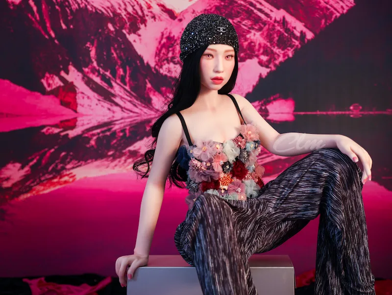 Realistic-sex-doll-Janice-sitting-on-stool-legs-spread