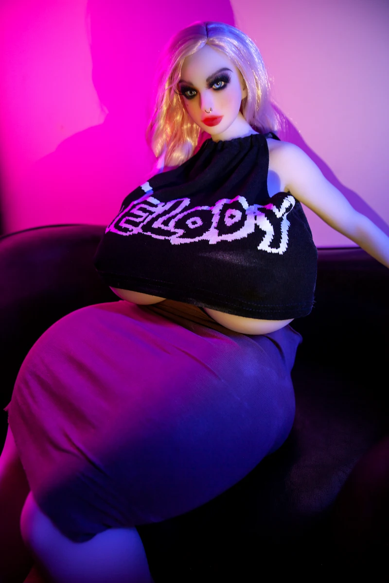 Big-breast-mini-sex-doll-72cm-Laria-leaning-on-sofa