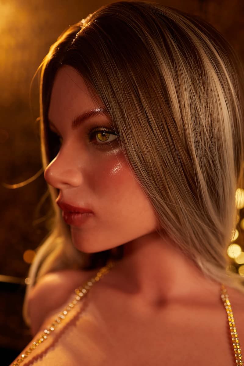 ULW662#Hedia Profile View: A detailed close-up capturing the doll's exquisite facial contours and textured golden-brown hair, featuring lifelike skin and striking eye details against a luxurious warm golden backdrop.