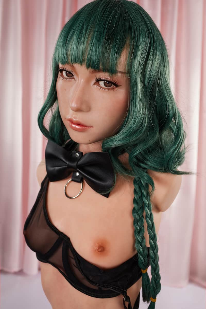 ULW 881# Mayu: This close-up, high-angle shot highlights the doll's delicate Japanese-style facial makeup with defined eyelashes and glossy lips, while clearly presenting the fair, smooth, and realistically textured skin of her full breasts.