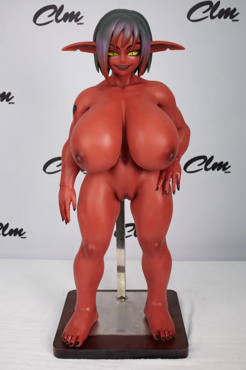 CLM factory photo of Si70 GB Zarga red skin goblin doll, front view on stand