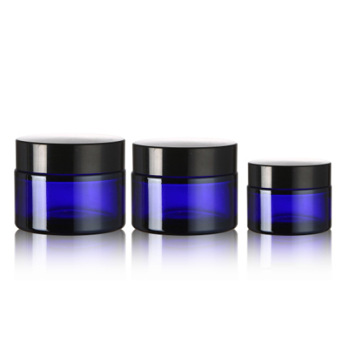 Cosmetic blue facial cream glass container jar with black cap lid