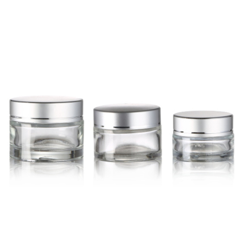 Transparent clear cosmetic face cream glass jar with silver cap lid