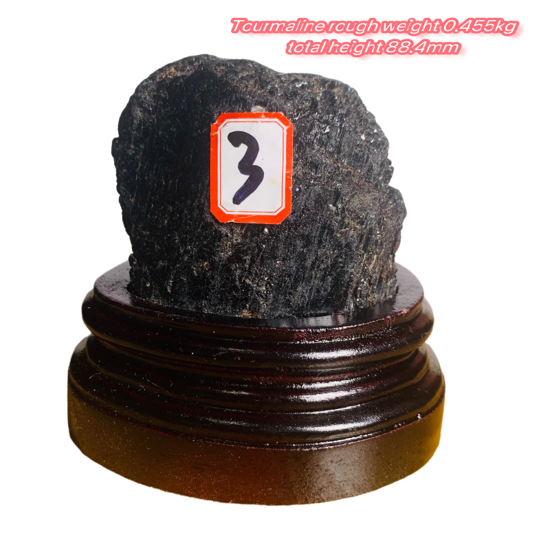 Black tourmaline rough stone ornament with wooden base