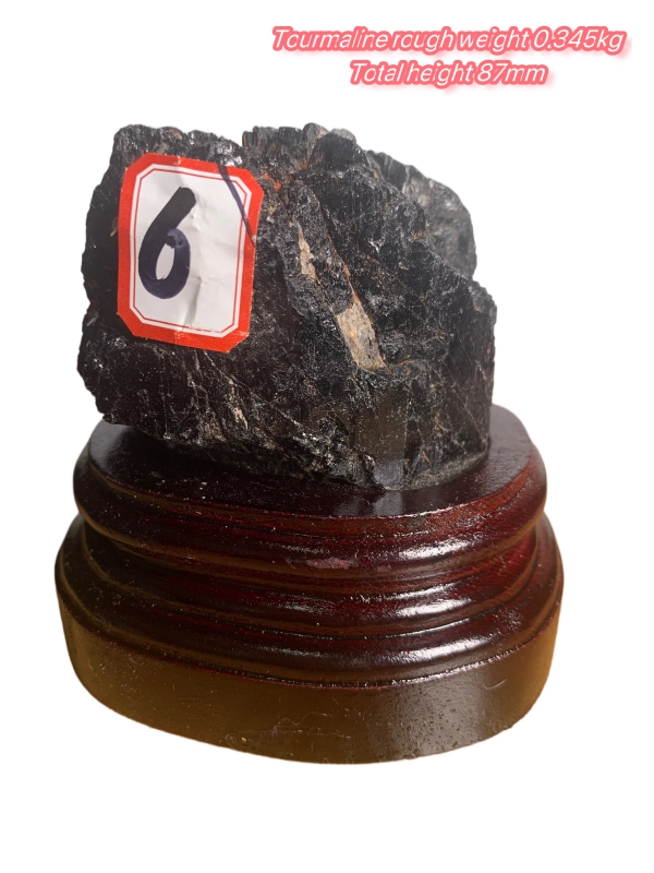 Black tourmaline rough stone ornament with wooden base