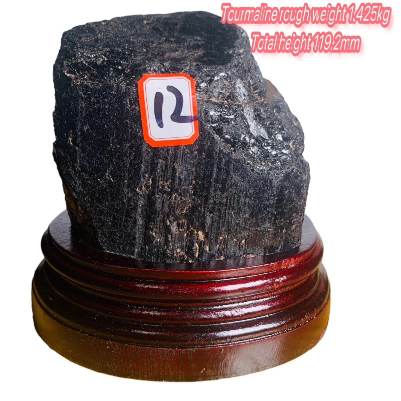 Black tourmaline rough stone ornament with wooden base