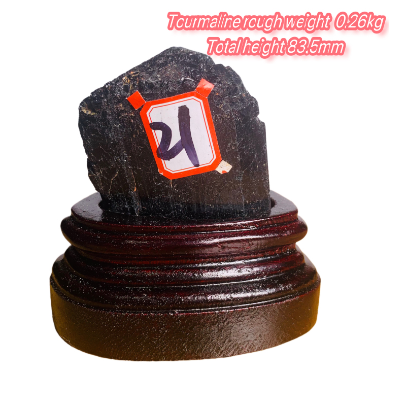 Black tourmaline rough stone ornament with wooden base