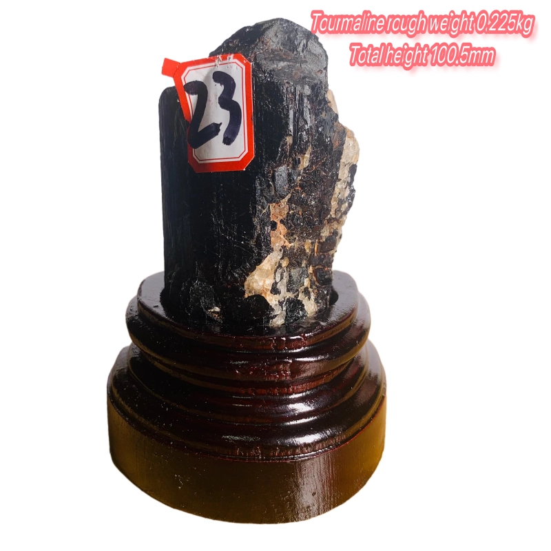 Black tourmaline rough stone ornament with wooden base