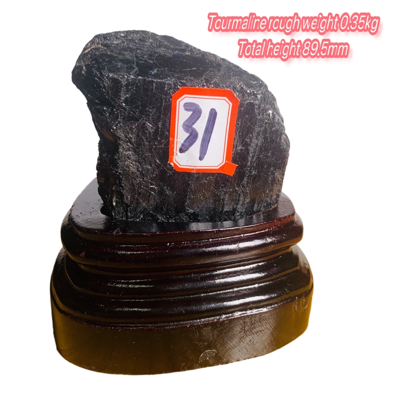 Black tourmaline rough stone ornament with wooden base