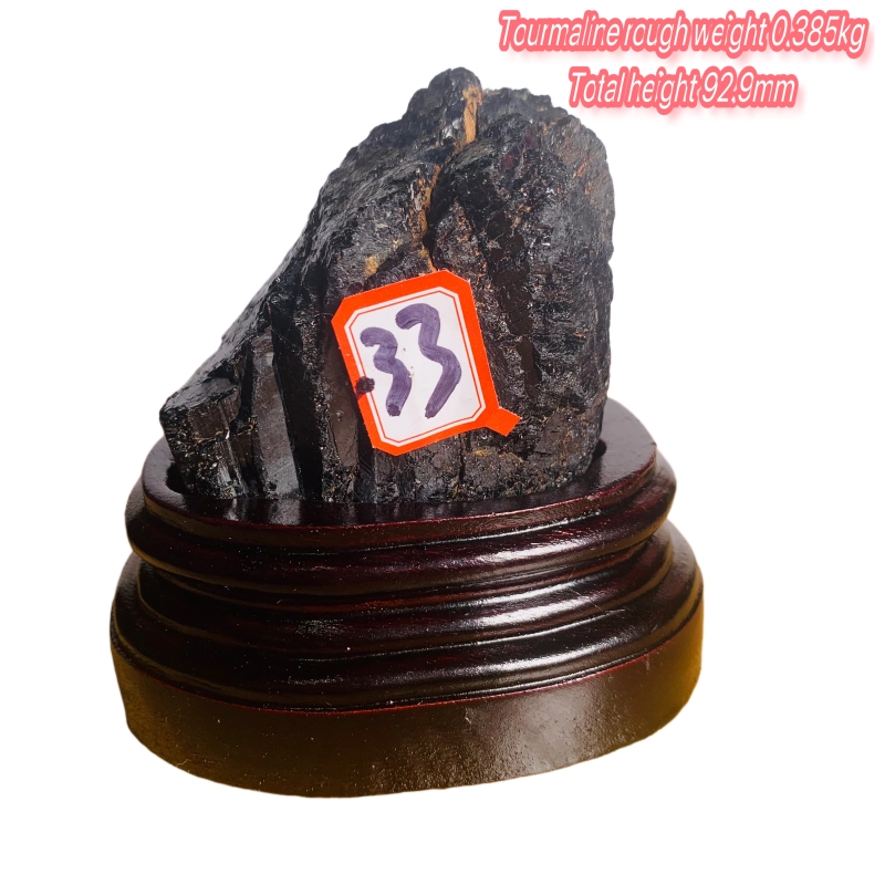 Black tourmaline rough stone ornament with wooden base