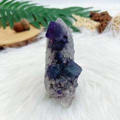 Purple cube fluorite with candle quartz
