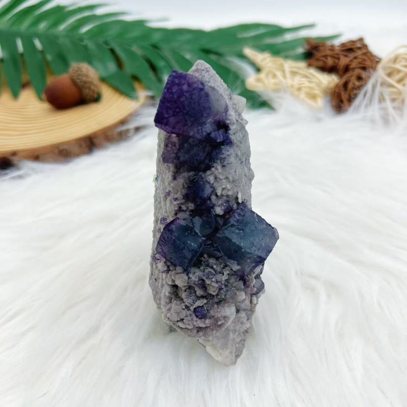 Purple cube fluorite with candle quartz