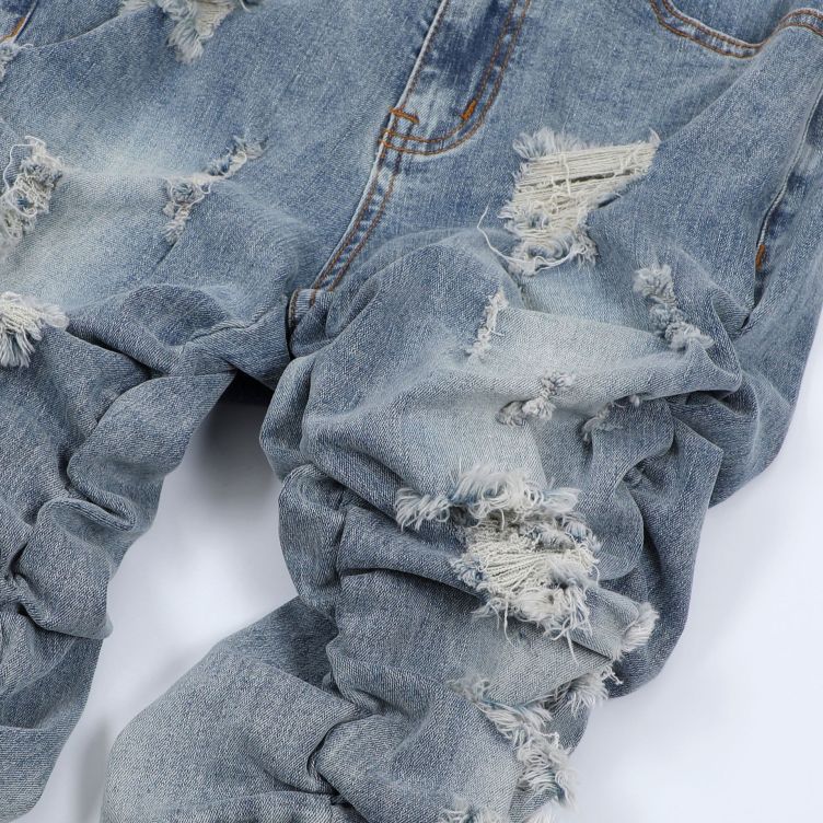 Pleated ripped jeans