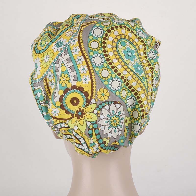 surgical scrub caps in black with  orange and white flowers in T/C