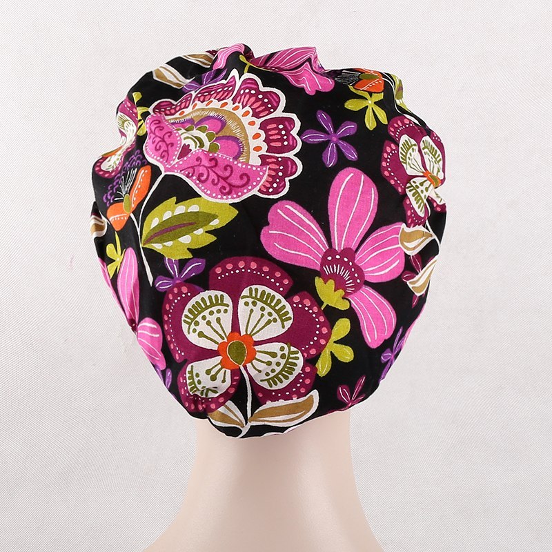 surgical scrub caps in black with pink flowers