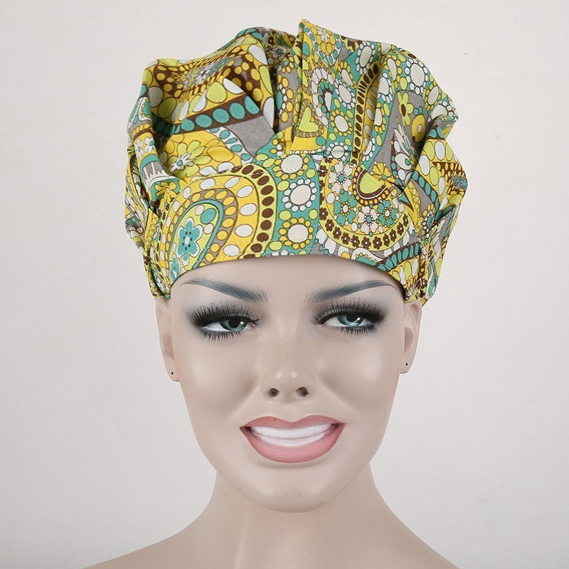 surgical scrub caps in black with  orange and white flowers in T/C