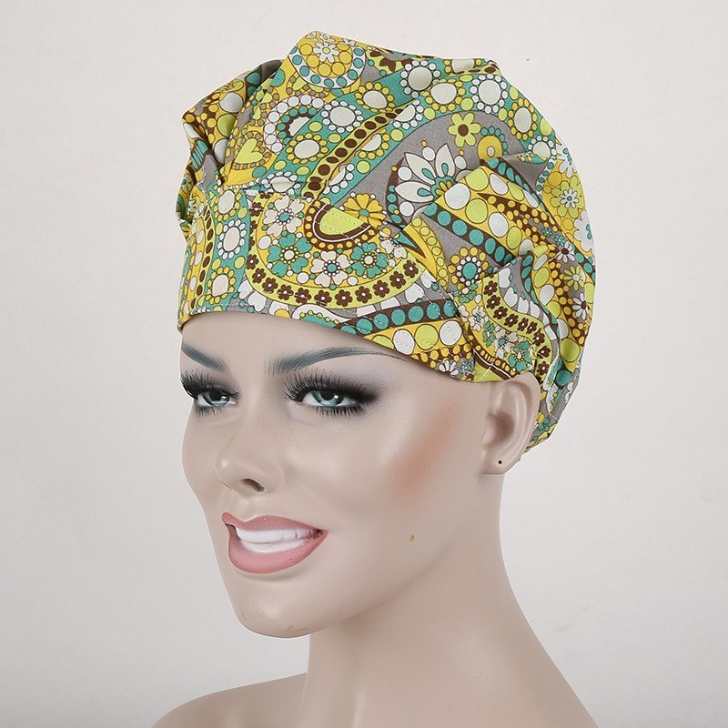 surgical scrub caps in black with  orange and white flowers in T/C