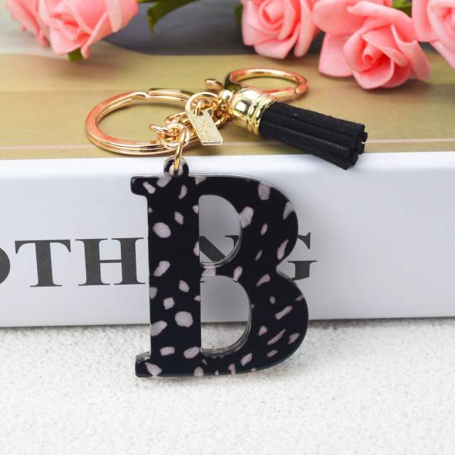 Black tassel white dots keychain