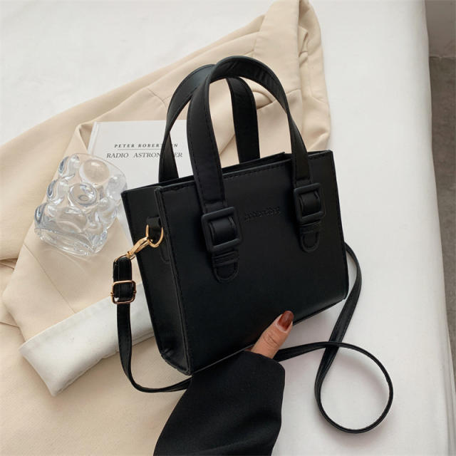 Solid color square shaped handbag