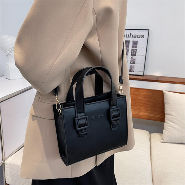 Solid color square shaped handbag