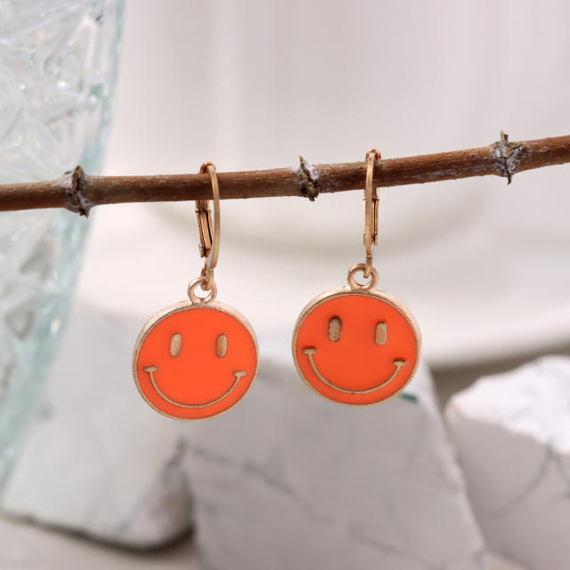 Enamel smile face huggie earrings