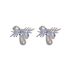 Crystal bow pearl drop earrings
