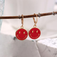 Enamel smile face huggie earrings