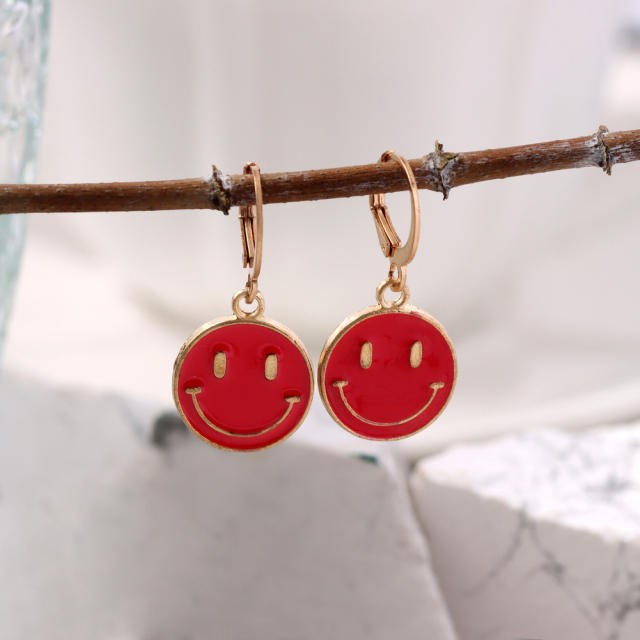 Enamel smile face huggie earrings