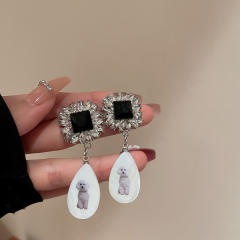 Vintage acrylic drop diamond earrings
