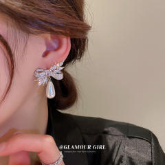 Crystal bow pearl drop earrings
