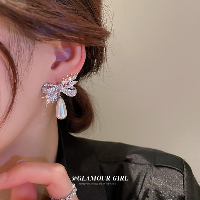 Crystal bow pearl drop earrings