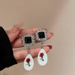 Vintage acrylic drop diamond earrings