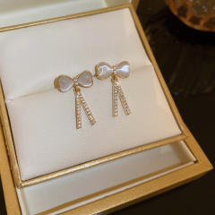 Opal stone bow diamond earrings