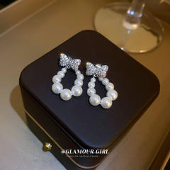 Cubic zircon bow pearl drop earrings