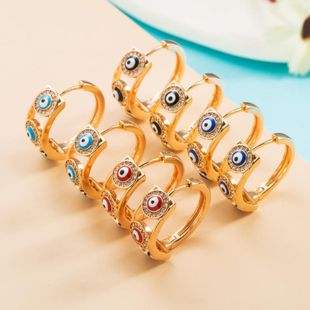 Enamel evil eye huggie earrings