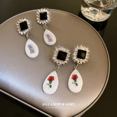 Vintage acrylic drop diamond earrings