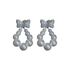 Cubic zircon bow pearl drop earrings