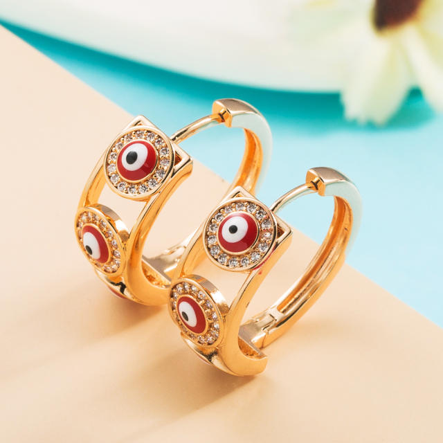 Enamel evil eye huggie earrings