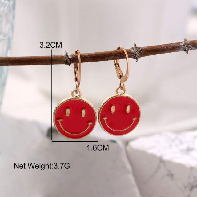 Enamel smile face huggie earrings