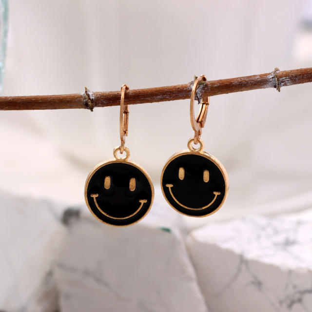 Enamel smile face huggie earrings