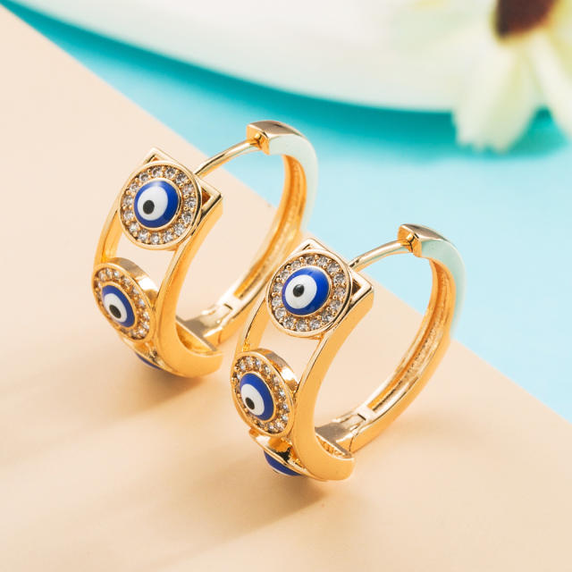 Enamel evil eye huggie earrings