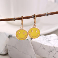 Enamel smile face huggie earrings