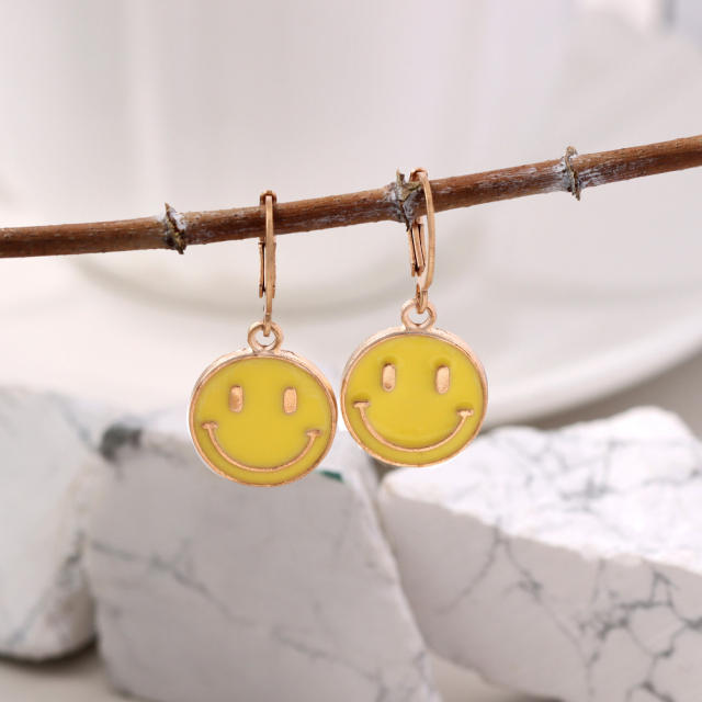Enamel smile face huggie earrings