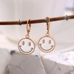 Enamel smile face huggie earrings