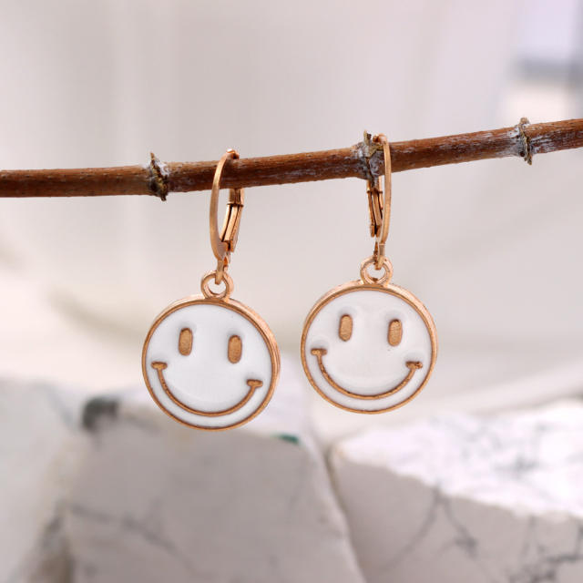 Enamel smile face huggie earrings