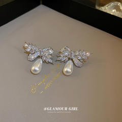 Crystal bow pearl drop earrings