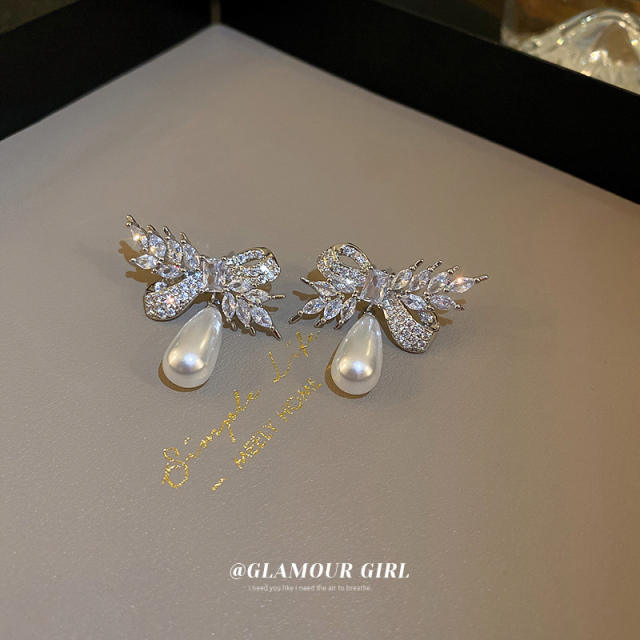 Crystal bow pearl drop earrings